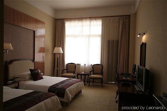 New Tai Garden Hotel Jinghong Room photo